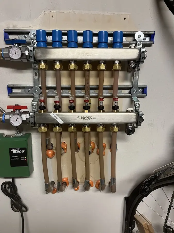 Plumber performing Water Heater Repair at a residential property in Glens Falls